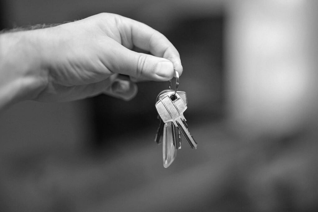 A hand holding a bunch of keys