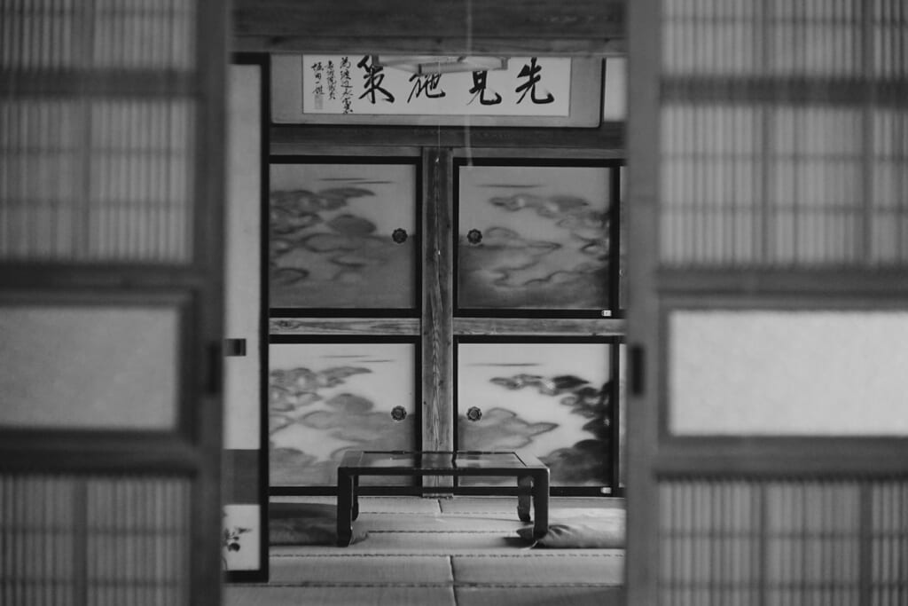A room in an old Japanese house with paper screens and sliding doors
